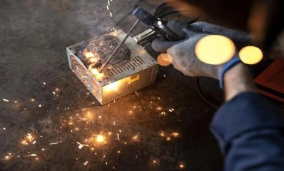 male-mechanic-working-his-workshop-1-405x245